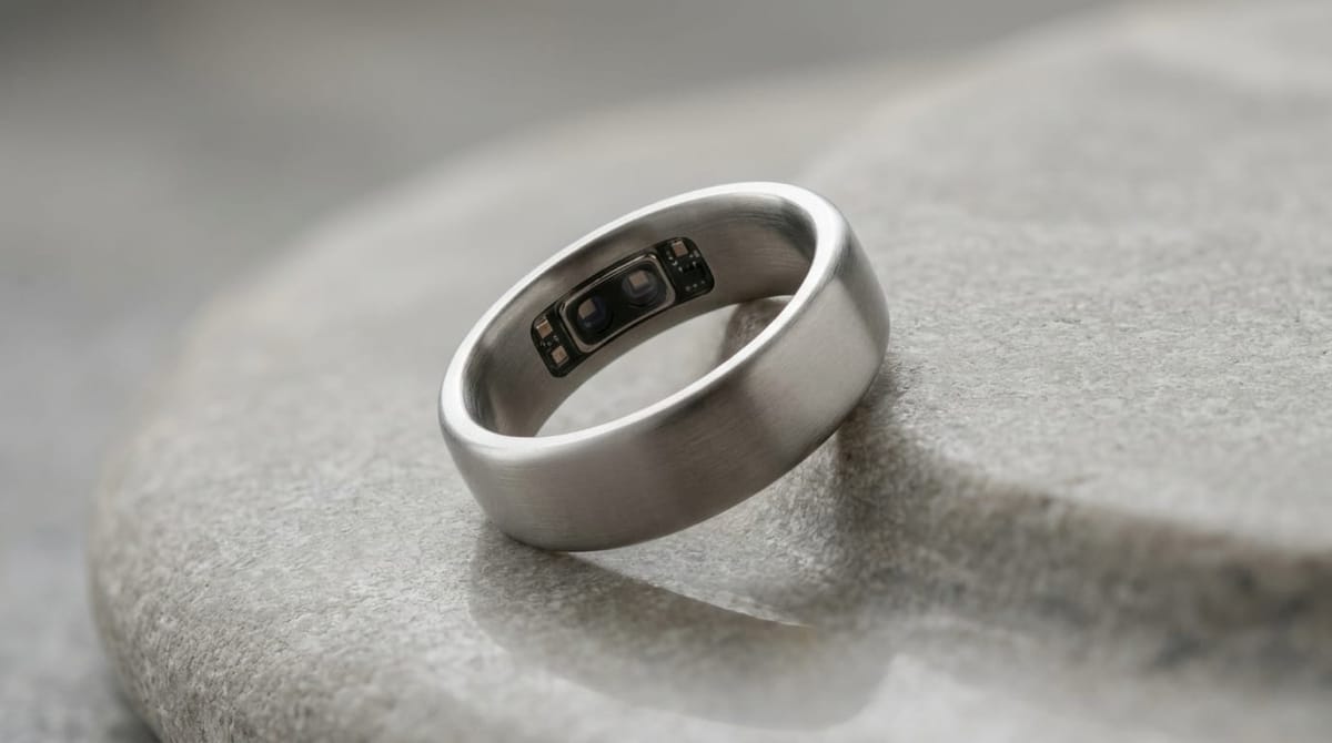 Leep Ring 1 smart ring in Starlight Silver titanium finish resting on grey stone